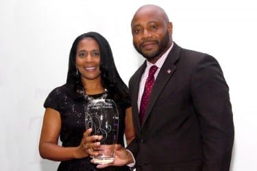 President Franklin accepts an honor from Michael Kates, executive director of the African American Museum of Iowa.