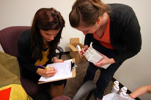 Female students packing medicine