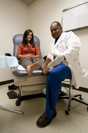 Dr. Bennett performs a foot examination on a patient at Des Moines University Foot and Ankle.