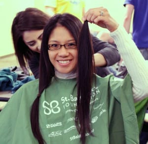 A DMU student lops off her long locks for cancer research.