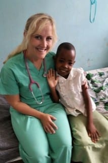 CJ Koozer with child in Tanzania