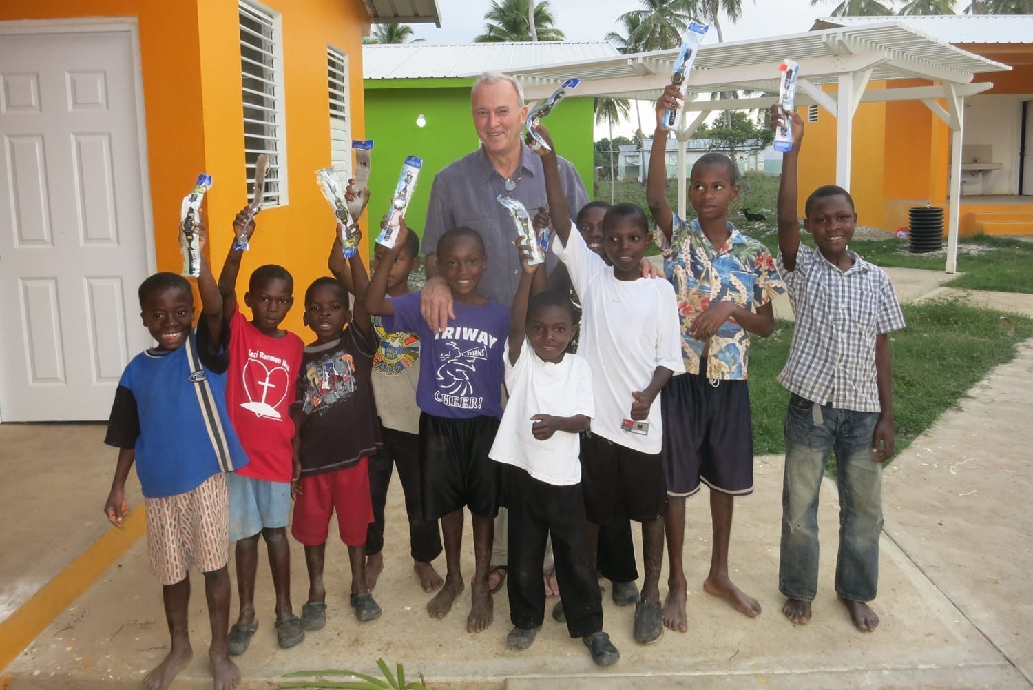 Rick Wilkerson, D.O.'80, and the orphans of La Concorde in Haiti.