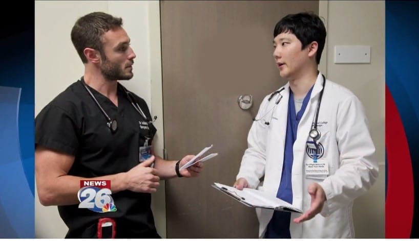 Ballard discusses a patient diagnosis with fourth-year MCG student Jung-Hoon Lee.